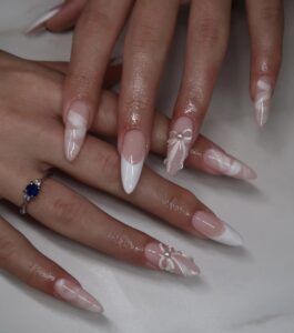 Read more about the article Ombré Bow Almond Nails That Are Too Cute to Ignore